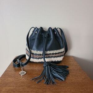 The Sak black leather drawstring closure shoulder/crossbody bag w embroidery